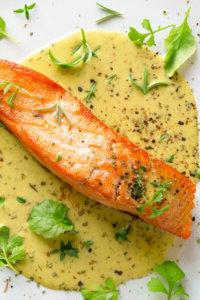 fried salmon with fresh garden cress, thyme, rosemary and dry sp